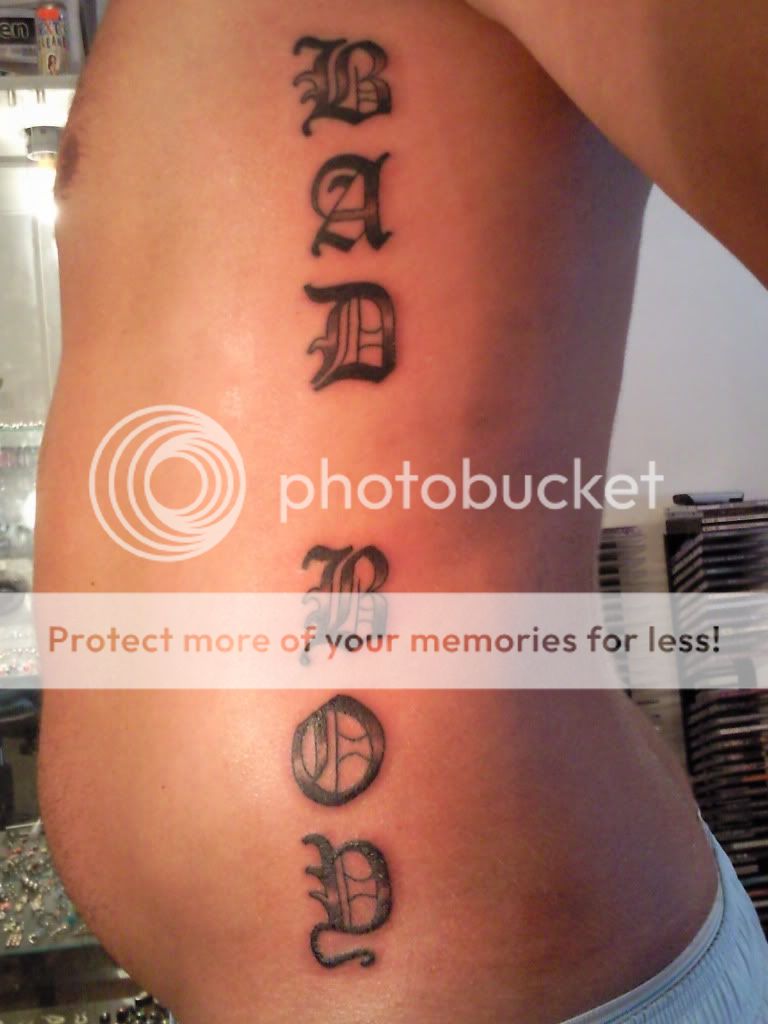 small tattoo on the ribs